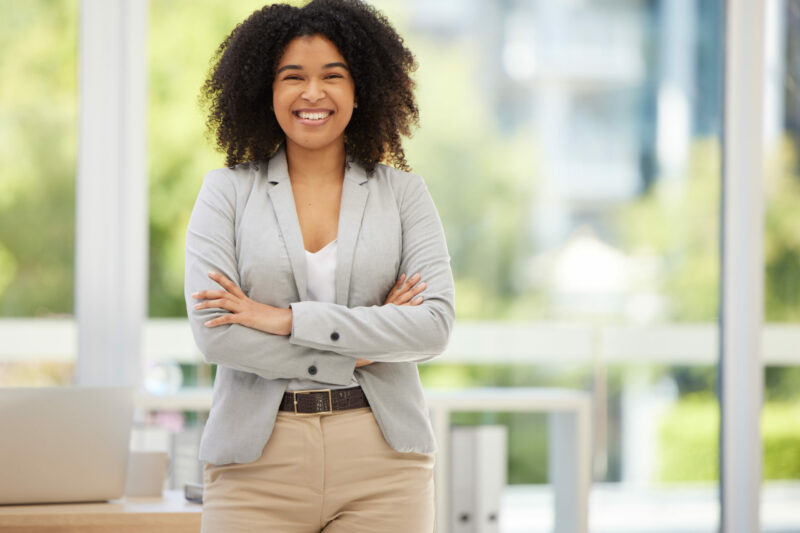 Business, confidence and portrait of happy black woman, worker or employee with pride in marketing career success. Women empowerment, corporate happiness or office girl satisfied with advertising job.